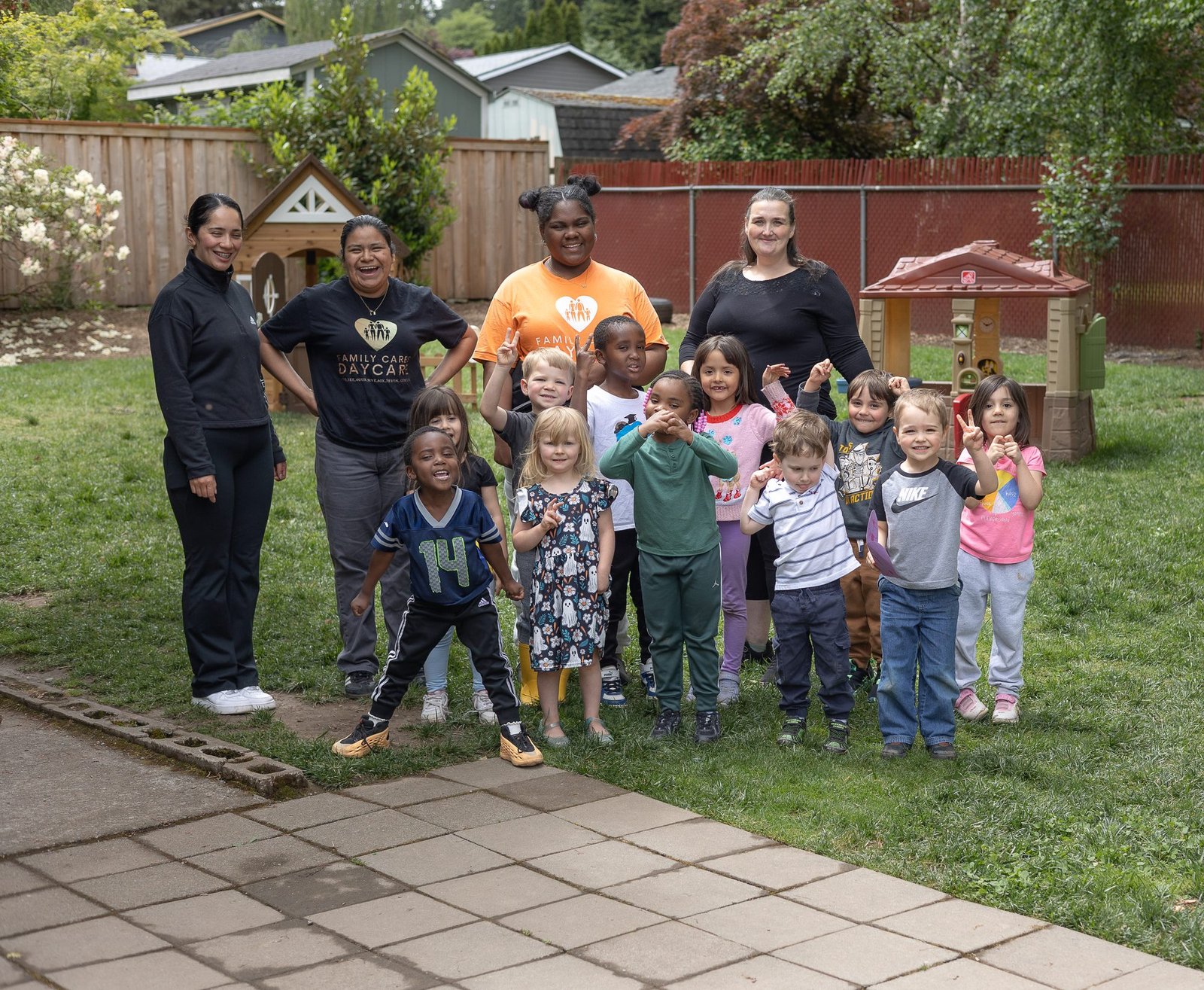 Family Cares Day Care teachers and children
